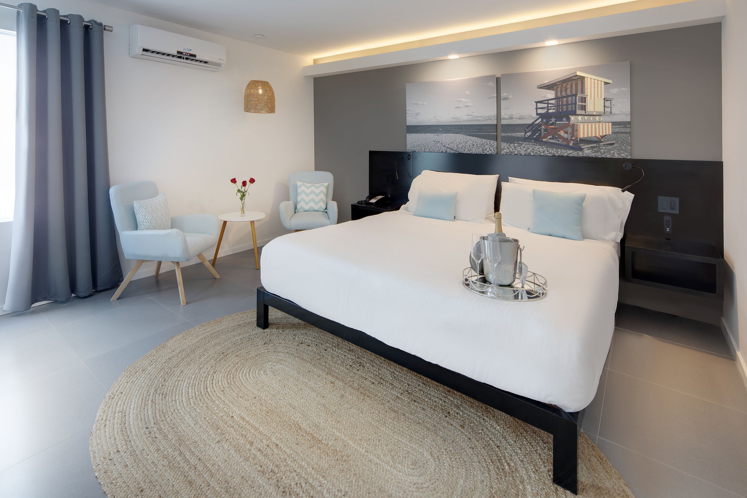 NK3 king room at MB Hotel prepared for a celebration, bed dressed with petals and a welcome setup