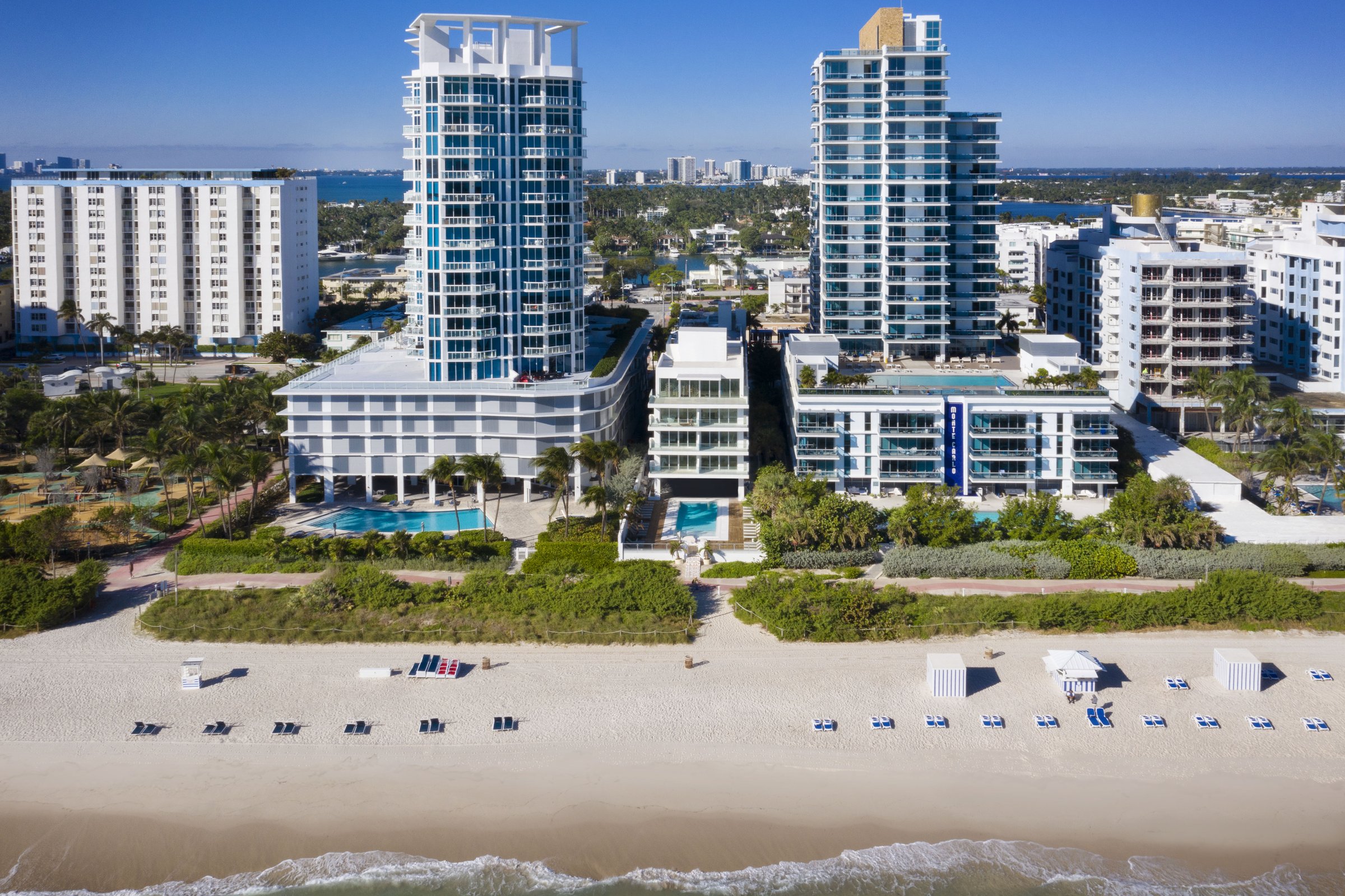 Aerial view of MB Hotel and the Miami Beach shoreline, the Atlantic running north along Collins Avenue