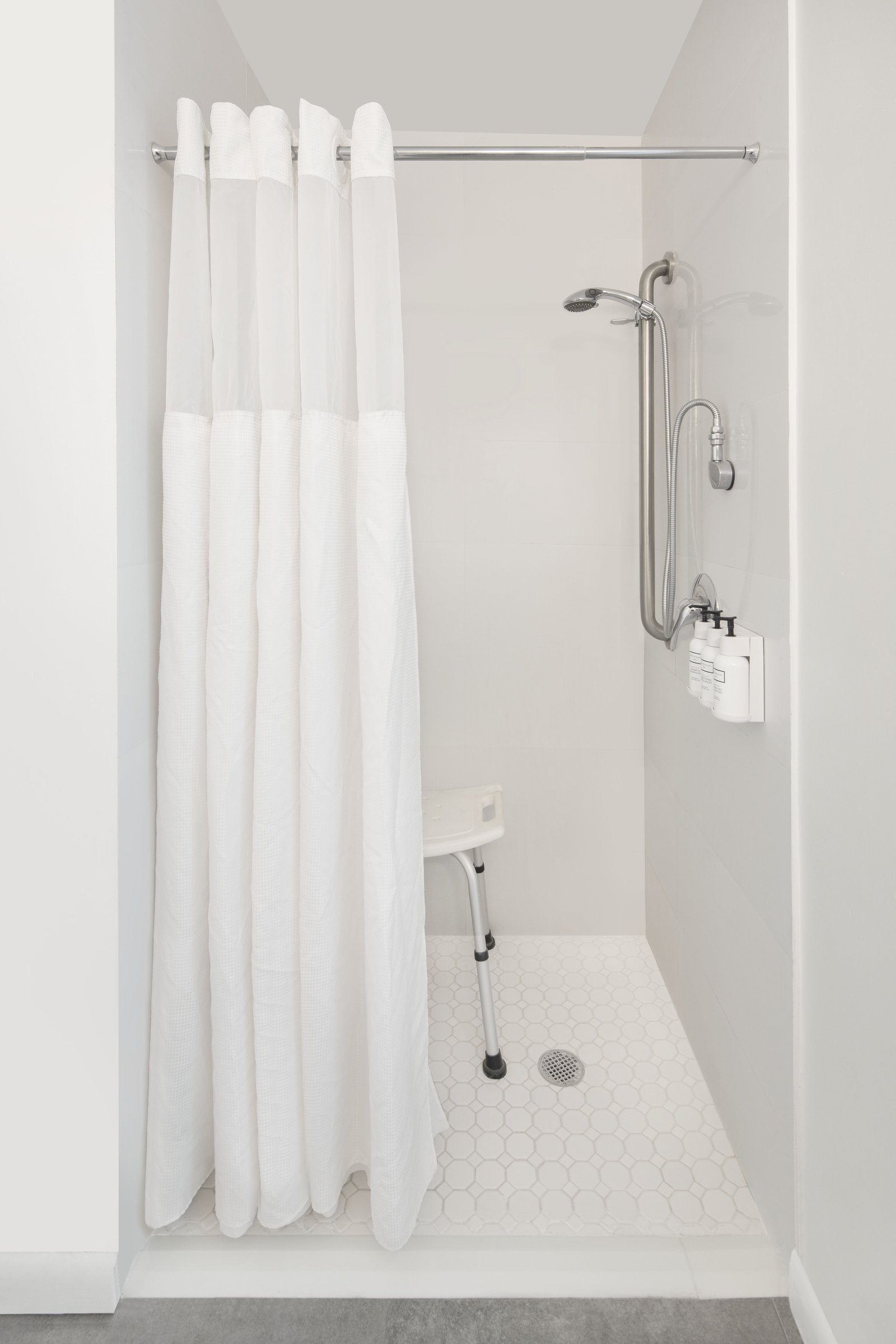 PNK1 Standard King Accessible, roll-in shower with fold-down seat and grab rails