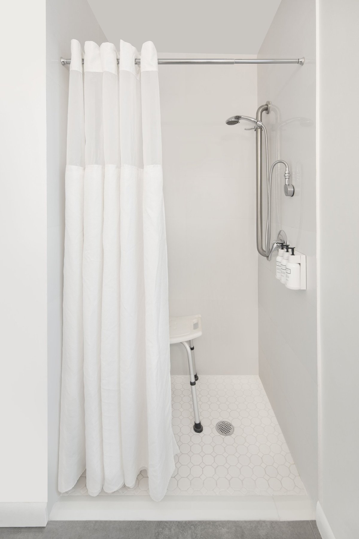 PNK1 Standard King Accessible, roll-in shower with fold-down seat and grab rails